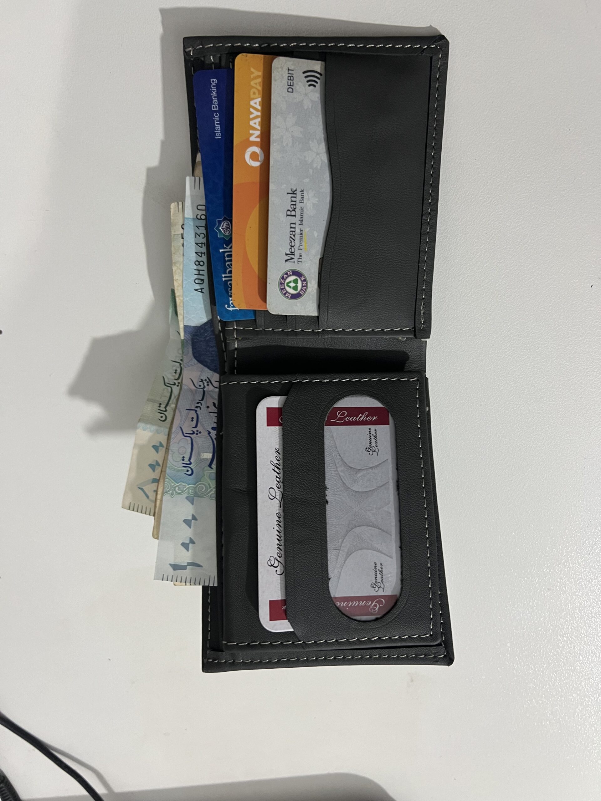 Slim Profile. Massive Capacity. Genuine Leather.